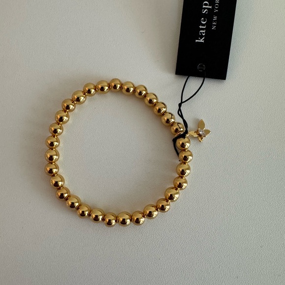 Kate Spade Gold-Tone Beaded Stretch Bracelet butterfly charm - Picture 1 of 2